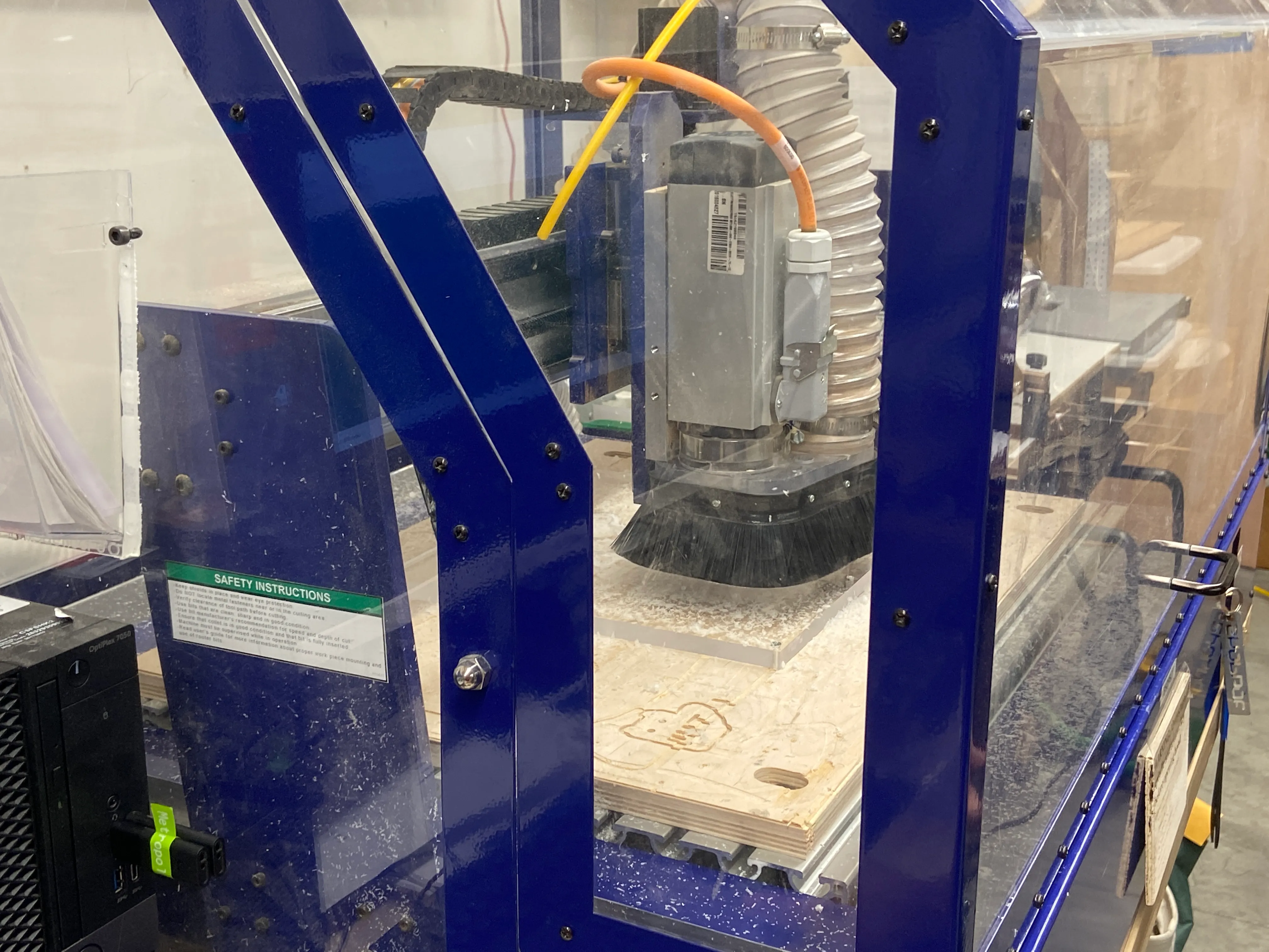 Sign being cut on a CNC router