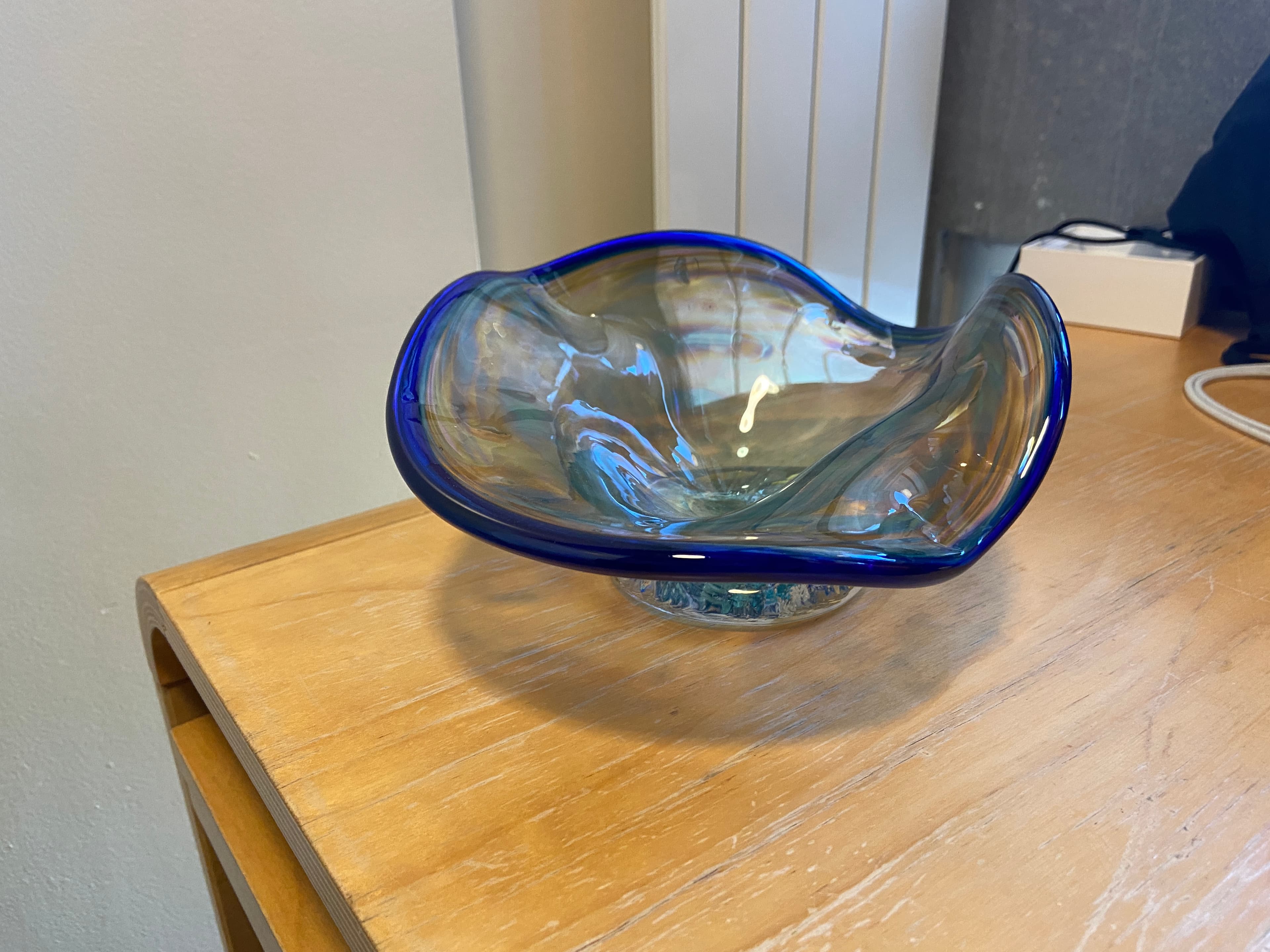 A ruffle bowl with a blue lip wrap